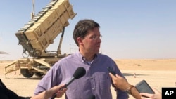Defense Secretary Mark Esper talks to reporters at Prince Sultan Air Base in Saudi Arabia, Oct. 22, 2019.