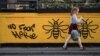  Britain Lowers Threat Level to 'Severe' as Bombing Probe Progresses