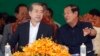 Cambodian Prime Minister Hun Sen, right, talks with Chinese Ambassador to Cambodia Xiong Bo, front left, during an inauguration ceremony of a sky bridge funded by China in Phnom Penh, July 2, 2018. 