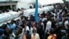 Mourners carry coffins containing the bodies of protesters killed in September rallies organized by the Union for Democracy and Social Progress (UDPS), during a funeral service at UDPS headquarters in Limete, Kinshasa, DRC, Nov. 1, 2016.