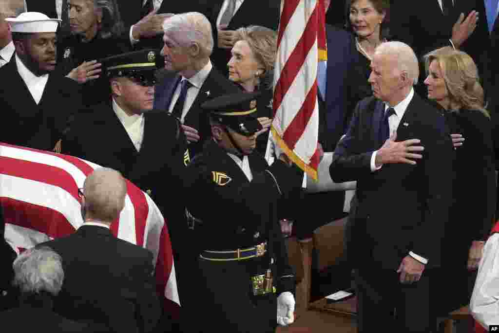 President Joe Biden, first lady Jill Biden and other former presidents watch as a body bearer team carries the casket of former President Jimmy Carter during the state funeral at Washington National Cathedral in Washington, Jan. 9, 2025.