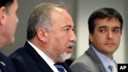 Israeli Defense Minister Avigdor Lieberman, center, speaks during a meeting with Defense Secretary Jim Mattis at the Pentagon, Oct. 19, 2017, in Washington.