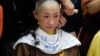 香港佔中人士陳淑莊9月9日佩戴黃絲帶落髮撐運動。