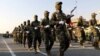 Members of Iraqi Popular Mobilization Forces take part in a military parade in the town of Taza, south of the northern oil city of Kirkuk, Iraq, June 28, 2019.