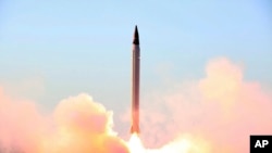 FILE - The Iranian Defense Ministry purports to have launched an Emad long-range ballistic surface-to-surface missile on Oct. 11, 2015. U.S. interests in the Iran nuclear deal are influencing the U.S. response to the crisis between Saudi Arabia and Iran, analysts say.