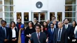 (File) Omar Jadwat, center, director of the ACLU's Immigrants' Rights Project, speaks at a news conference outside a federal courthouse in Greenbelt, Maryland, Oct. 16, 2017, following a hearing regarding three lawsuits against Trump administration.