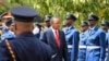 Kenyan President Uhuru Kenyatta inspects a guard of honor as he arrives at the Parliament Building to deliver his state of the nation address in Nairobi, March 27, 2014. 