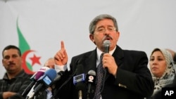 FILE - Ahmed Ouyahia, who was then Algeria's prime minister, speaks during a meeting of the National Democratic Rally in Algiers, May 5, 2012. 