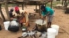 A family in Chachacha village in Chipinge prepares Zimbabwe’s popular, thick porridge called sadza made of corn meal and served with relish, March 2016. Most households eat sadza twice a day, at lunch and dinner. But as the country’s hunger worsens, the staple food might soon become a delicacy. (S. Mhofu/VOA)