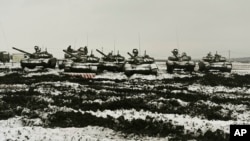 Russian T-72B3 tanks take part in drills at the Kadamovskiy firing range in the Rostov region in southern Russia, Jan. 12, 2022. 