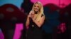 Britney Spears introduces Miley Cyrus at iHeartRadio Music Festival, day 2, Sept. 21, 2013 in Las Vegas, NV. 