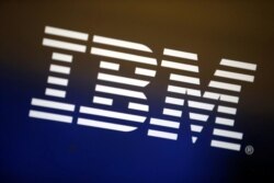 FILE - The IBM logo is seen on a computer screen.