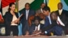 FILE - South Sudan President Salva Kiir, seated, signs a peace deal as Kenya’s President Uhuru Kenyatta, center-left, Ethiopia’s Prime Minister Hailemariam Desalegn, center-right, and Uganda’s President Yoweri Museveni, right, look on in Juba, South Sudan, Aug. 26, 2015. President Salva Kiir and his former vice president and rebel leader Riek Machar failed to form a unity transitional government on Jan. 23, 2016.