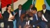 FILE - S. Sudan President Salva Kiir, seated, signs a peace deal as Kenya’s President Uhuru Kenyatta, center-left, Ethiopia’s Prime Minister Hailemariam Desalegn, center-right, and Uganda’s President Yoweri Museveni, right, look on in Juba, S. Sudan, Aug. 26, 2015.