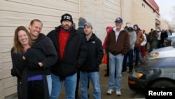 People wait in line to be among the first to legally buy recreational marijuana at the Botana Care store in Northglenn, Colorado, Jan. 1, 2014.
