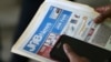 FILE - An applicant attends a job fair in Miami Lakes, Florida. 