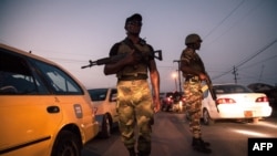 FILE- Soldiers patrol in the streets of Buea, South West Region of Cameroon, April 26, 2018. Saint Joseph's College near Buea was attacked late Sunday, a government official reported Monday.