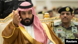 Saudi Crown Prince Mohammed bin Salman gestures during a military parade by Saudi security forces in preparation for the annual Haj pilgrimage in the holy city of Mecca, Saudi Arabia, Aug. 23, 2017. Saudi Arabia called off talks with Qatar shortly after reports it had agreed to talks.