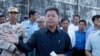 Provincial Gov. Kuoch Chamroeun speaks as the cruise ship Westerdam is docked off Sihanoukville, Cambodia, Feb. 13, 2020. The ship turned away by other governments because of virus fears anchored Feb. 13 off Cambodia for health checks of those on board.