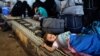 One of Syria's internally displaced children sleeps by her family's belongings, Bab Al-Salameh border crossing, Azaz, Aug. 23, 2012.