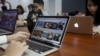 FILE - People work at the office of food-finder app Lozi in Hanoi, Vietnam, April 7, 2016. Vietnam's tech startups are emerging as a force to be reckoned with as foreign private equity funds bet the country's talented young brains will yield more successes. 