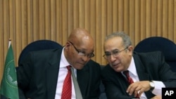S. African President and Chairperson of the AU Committee on Libya, Jacob Zuma, left, talks with Ramtane Lamamra, African Union Commissioner for Peace and Security in Addis Ababa, Ethiopia, August 26, 2011 during a conference on Libya.
