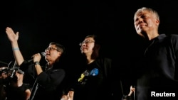 Para pendiri gerakan permbangkangan sipil Occupy Central, dari kiri ke kanan, Chan Kin-man, Benny Tai dan Chu Yiu-ming, meluncurkan gerakan tersebut, Agustus 2014.