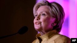 FILE - Former Secretary of State Hillary Clinton speaks during a fundraising event for Big Sister Association of Greater Boston, Dec. 5, 2017, in Boston. 
