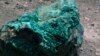 A piece of malachite, a copper ore, is seen at the bottom of Congolese state mining company Gecamines' Kamfundwa open pit copper mine, Jan. 31, 2013. 