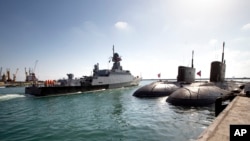FILE - The Russian missile ship Veliky Ustyug departs the Russian naval base in Tartus, Syria, in the eastern Mediterranean, Sept. 26, 2019.