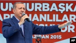 FILE - President Recep Tayyip Erdogan addresses a rally ahead of general elections in Ardahan, Turkey, June 6, 2015. 