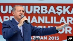 FILE - Turkey's President Recep Tayyip Erdogan addresses an election rally ahead of the upcoming general elections, in Ardahan, Turkey, June 6, 2015. 