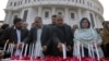 Pakistani lawmakers from provincial Khyber Pakhtunkhwa assembly light candle during a ceremony to mark second anniversary of a Taliban attack in 2014 on a school in Peshawar, Dec. 16, 2016.
