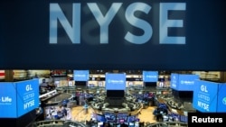 Traders work on the floor at the New York Stock Exchange (NYSE) in New York, Aug. 12, 2019.