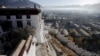FILE - Morning mist covers downtown as seen from atop the Potala Palace in Lhasa, Tibet Autonomous Region, China.