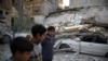 Trump, May Blame Syria, Russia for Eastern Ghouta Humanitarian Woes