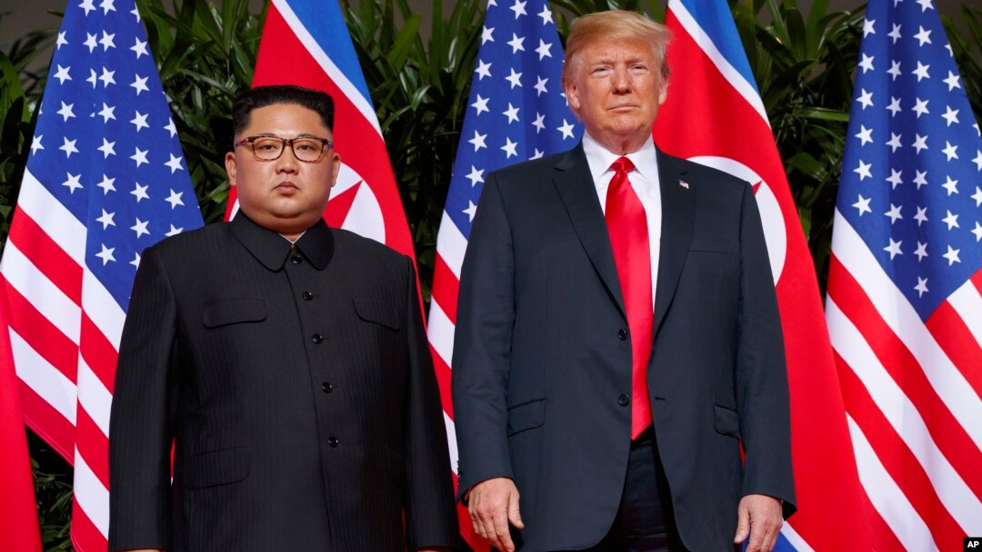 FILE - U.S. President Donald Trump, right, meets with North Korean leader Kim Jong Un on Sentosa Island, in Singapore, June. 12, 2018. 