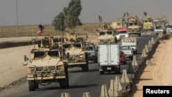 A convoy of U.S. vehicles is seen after withdrawing from northern Syria, on the outskirts of Dohuk, Iraq, Oct. 21, 2019. 