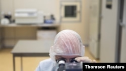 FILE PHOTO: A specialist works at Binnopharm pharmaceutical plant which develops "Gam-COVID-Vac" vaccine against the coronavirus disease near Moscow