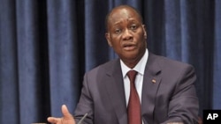 Ivory Coast President Alassane Ouattara speaks to reporters during a news conference at the United Nations headquarters in New York, July 27, 2011