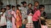 FILE - Children wait in line for food in Mekele, the capital of Ethiopia's conflict-ridden Tigray region, June 23, 2021.