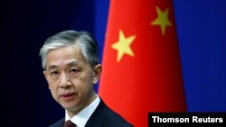 Chinese Foreign Ministry spokesman Wang Wenbin speaks during a news conference in Beijing