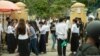Students of BAC II examination hung around the examination center after finishing taking their exams, Phnom Penh, Cambodia, August 18, 2018. (Ty Aulissa/VOA Khmer) 