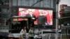 A television screen shows Chinese state media CCTV's footage of North Korean leader Kim Jong Un's meeting with Chinese President Xi Jinping in Pyongyang, at a street in Beijing, China, June 20, 2019