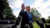 President Donald Trump waves off a question from a reporter on the South Lawn of the White House, in Washington, Nov. 8, 2019.