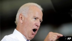 FILE - Vice President Joe Biden speaking during a visit at Portsmouth Naval Shipyard in Kittery, Maine, Sept. 3, 2014. 