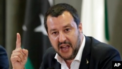 FILE - Italian Interior Minister Matteo Salvini makes a point during a joint press conference with Vice President of Libyan Parliamentary Council Ahmed Maitig, in Rome, July 5, 2018.