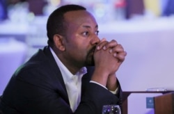 FILE - Ethiopia's Prime Minister Abiy Ahmed attends the launch of a mobile phone-based financial service named Telebirr mobile money service, in Addis Ababa, May 11, 2021.