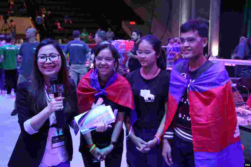 VOA Khmer reporter Chenda Hong interview the Cambodian youth robotics team immediately after their winning of the first competition during the First Global Challenge robotics competition in Washington, DC, Monday, July 17, 2017. (Nem Sopheakpanha/VOA Khmer) 