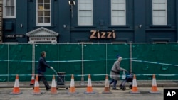 A police cordon and fence are placed outside a Zizzi restaurant near the area where former Russian double agent Sergei Skripal and his daughter were found critically ill following exposure to the Russian-developed nerve agent Novichok in Salisbury, England, March 13, 2018. 